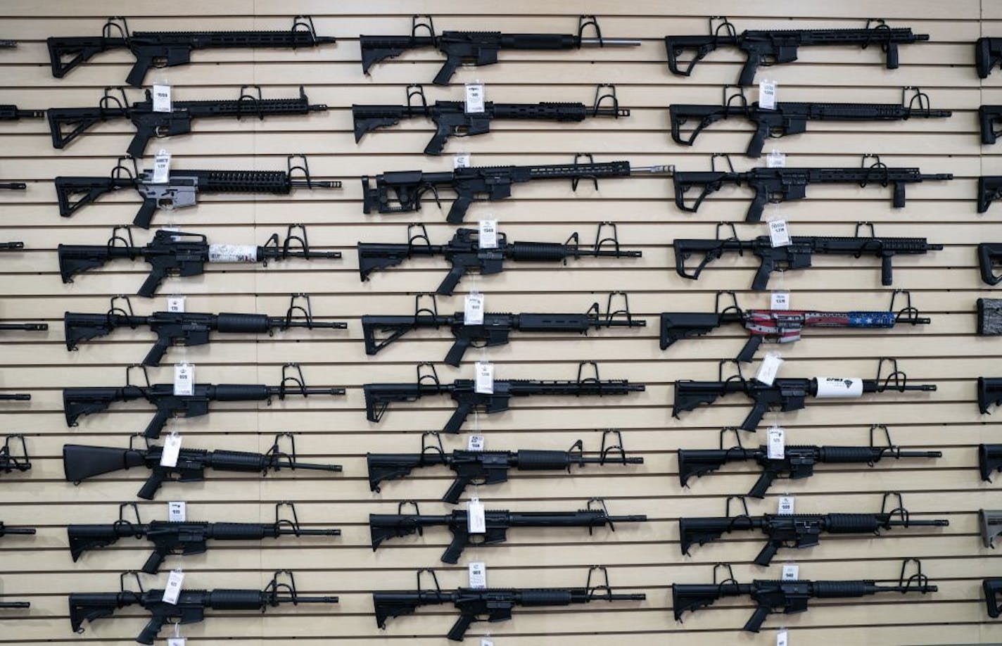 Semi-automatic rifles, including some AR-15s, on display at Bill's Gun Shop in Robbinsdale, Minn., on Tuesday, August 6, 2019. T