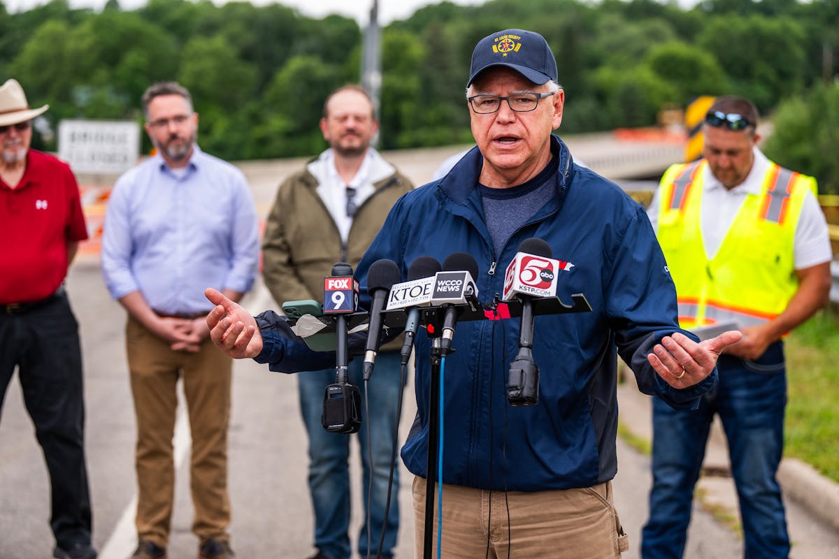 Gov. Tim Walz addresses flooding at the Rapidan Dam in Mankato on Tuesday, while also responding to questions about Wednesday's gathering of Democrati
