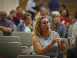 "Is this set in stone?" repeatedly shouted Saundra Little from her seat during a community meeting to discuss plans to move a group of sex offenders i