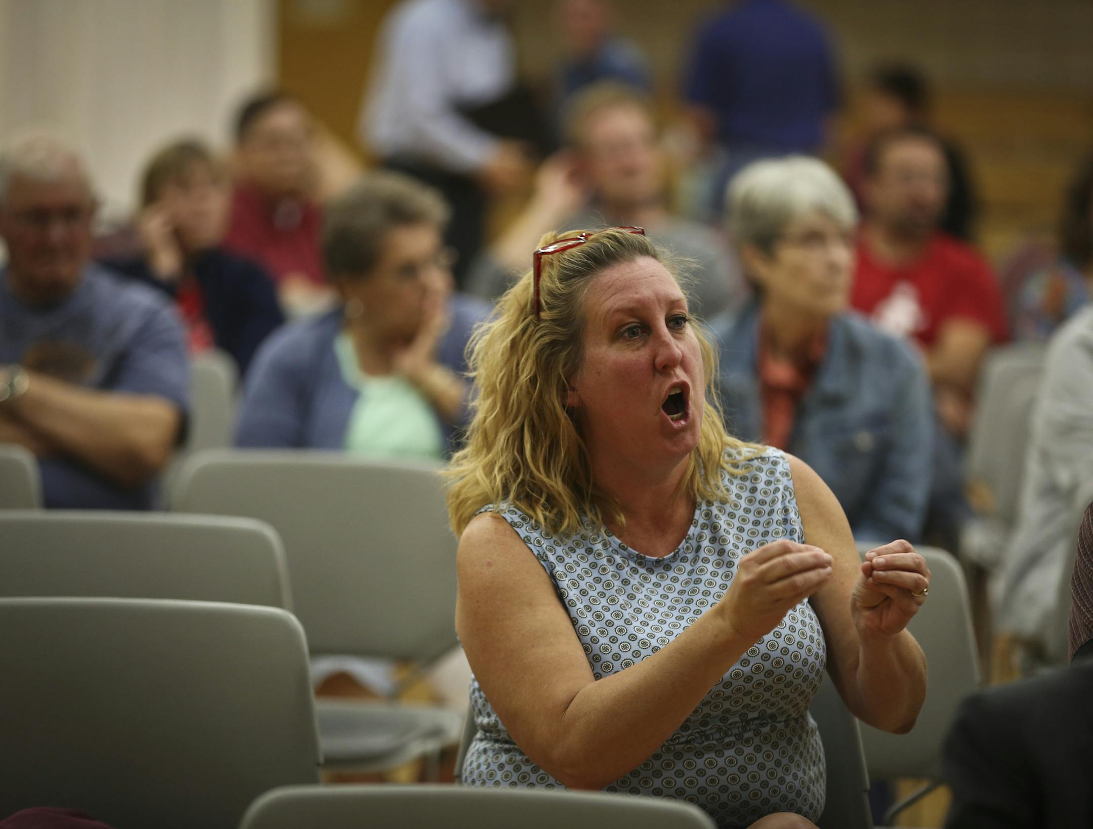"Is this set in stone?" repeatedly shouted Saundra Little from her seat during a community meeting to discuss plans to move a group of sex offenders into a facility in Cambridge, Minn., on Tuesday, October 1, 2013. ] (RENEE JONES SCHNEIDER &#x2022; reneejones@startribune.com) Saundra CQ