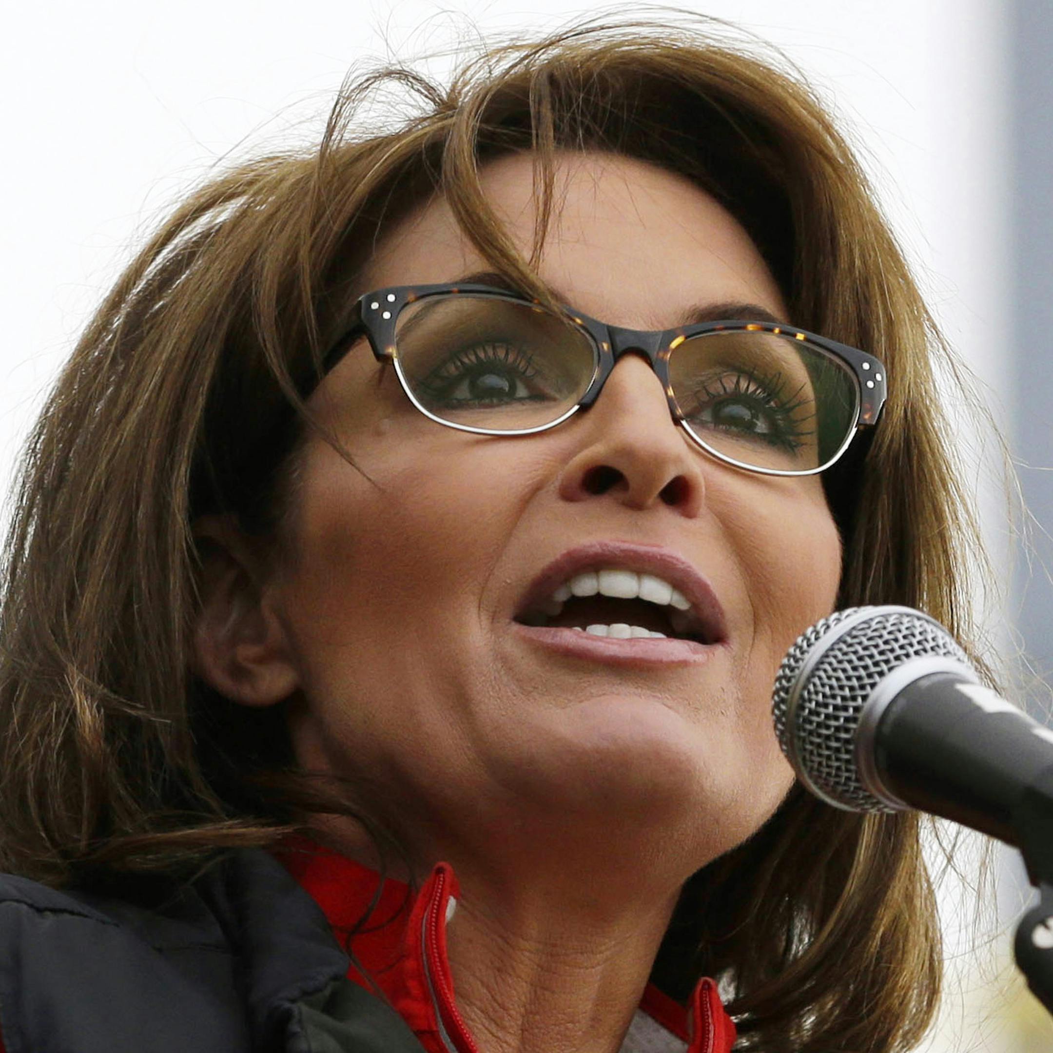 FILE - This Oct. 12, 2013 file photo shows former Alaska Gov. Sarah Palin during a rally supporting Steve Lonegan who is running for the vacant New Jersey seat in the U.S. Senate, in New Egypt, N.J. The Sportsman Channel said Monday it has hired Sarah Palin to be host of a weekly outdoors-oriented program that will celebrate the "red, wild and blue" lifestyle. The program, "Amazing America," will debut next April. (AP Photo/Julio Cortez, File)