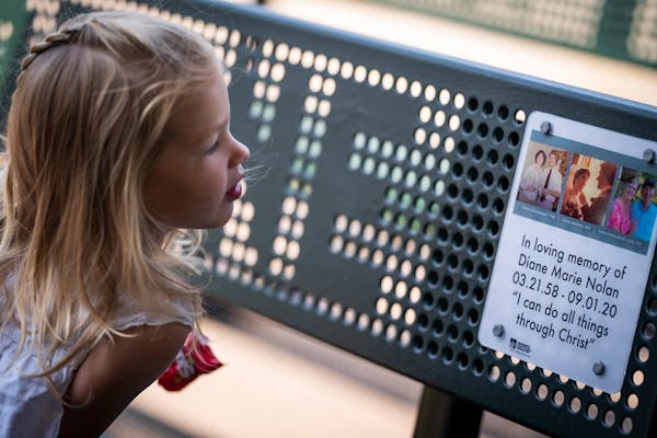Quinn Hawkins, 2, looked at the bench dedicated to her late-grandmother.
