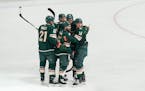 Minnesota Wild Luke Kunin (19) is in the center of congratulations for Minnesota's sixth and final goal of the game beating Edmonton 6-5. ] GLEN STUBB