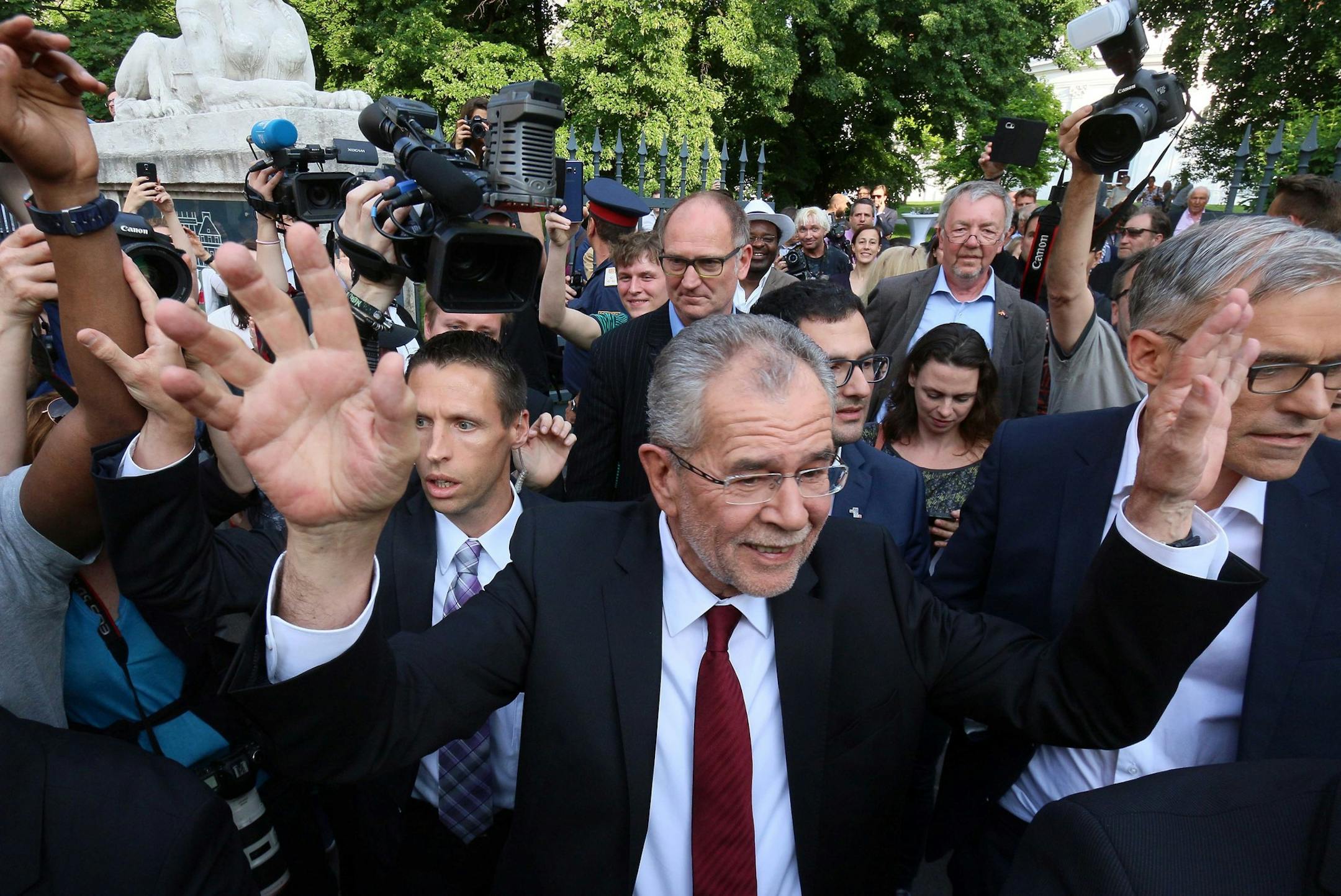 Alexander Van der Bellen winner of Austria's presidential election waves to his supporters in Vienna, Austria, Monday, May 23, 2016. Left-leaning candidate Alexander Van der Bellen won the election to become Austrian president Monday, but his right-wing rival was only narrowly behind, a result that reflects the growing strength of Europe's anti-EU political movements.