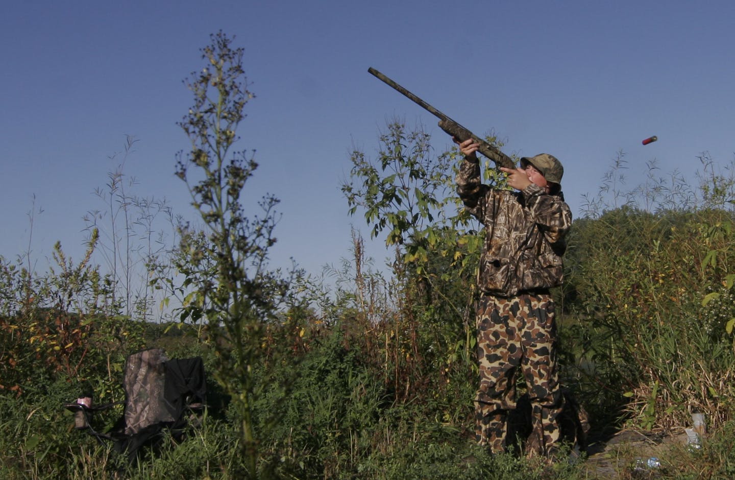 Sam Olson, 14, of Minnetonka, fired at a duck Saturday on Youth Waterfowl Day while hunting in the Minnesota Valley National Wildlife Refuge near Shakopee.