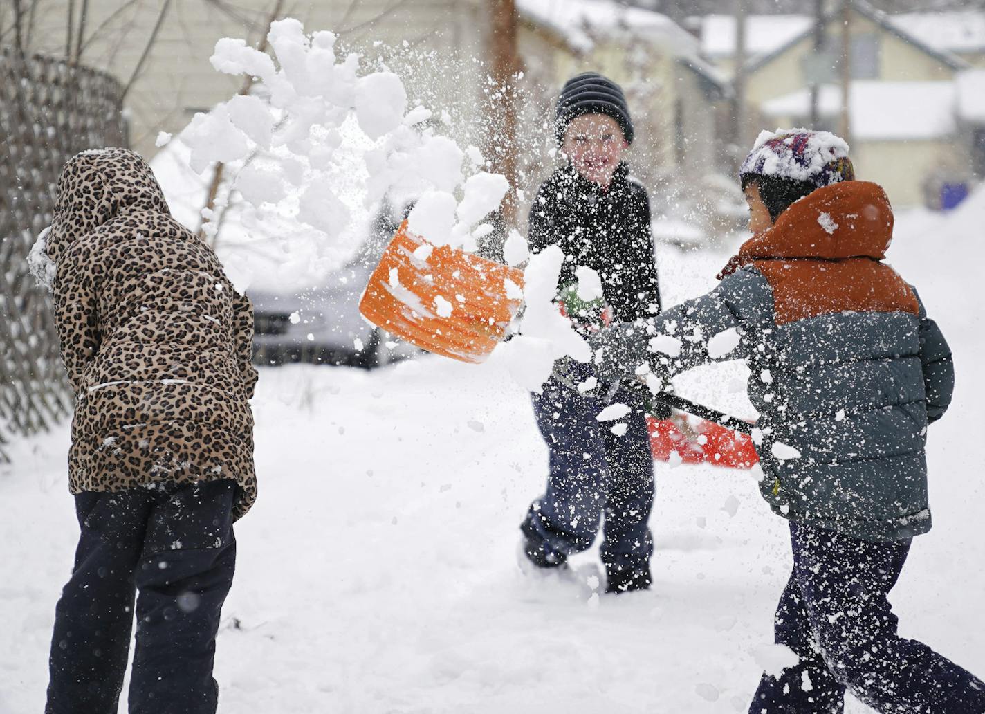 Alma prepared for a shovel full of snow from Sean. Alma Connoy, 7, her brother Graham Connoy, 8 and their neighbor and friend Sean Barker, 8, spent their spring break shoveling and enjoying an epic and good natured snowball fight. A storm expected to dump 10 inches of snow Tuesday, April 3, 2018, in central Wisconsin and southern Minnesota was making April feel more like January. Unrelenting snowfall was expected all day, making the commute home challenging in Minnesota's Twin Cities and other l