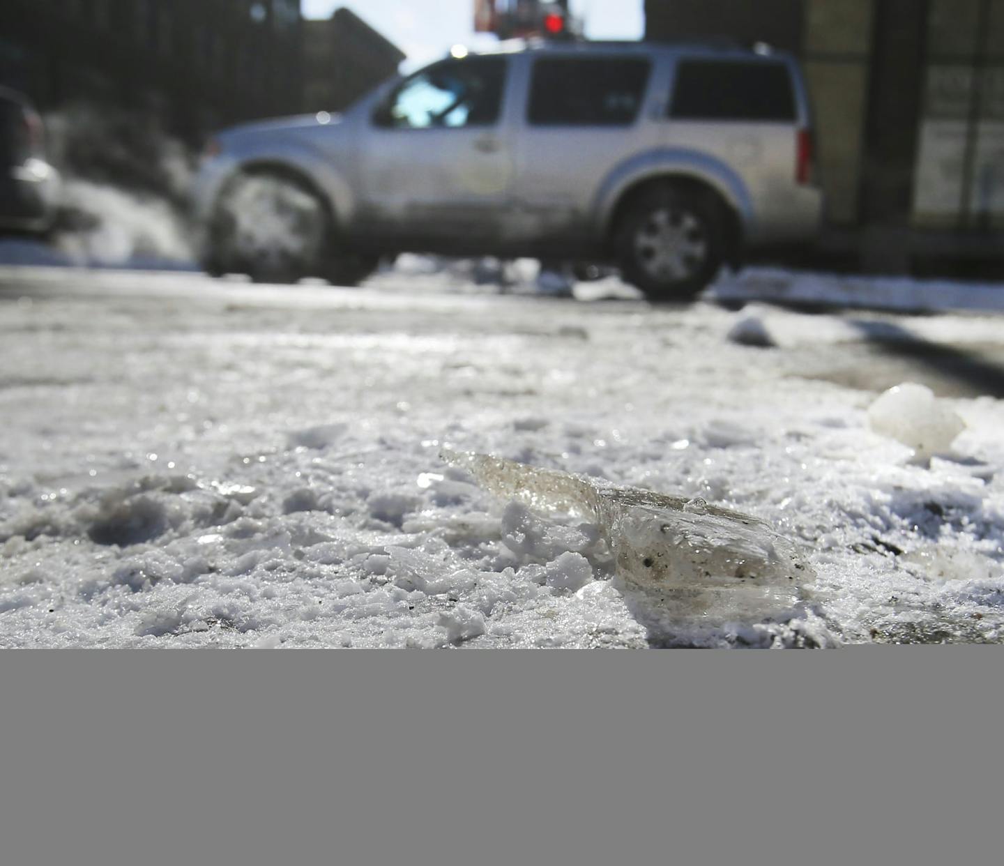 Motorists navigate thick, ice-covered roads while entering Minneapolis from I-394 and I-94 Tueday, Feb. 25, 2014.