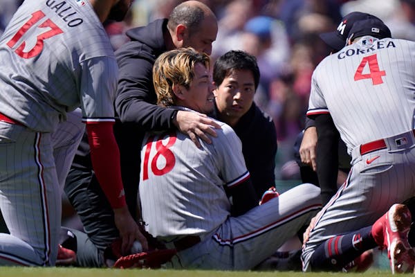 Kenta Maeda of the Twins got assistance after being struck by a line drive in Wednesday’s game in Boston.