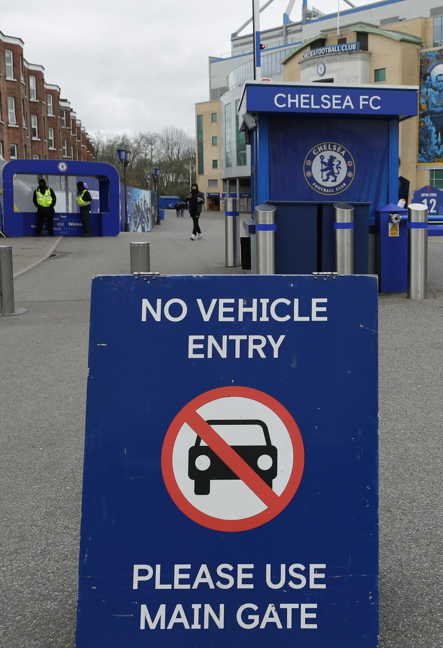 A sign at Chelsea's Stamford Bridge stadium, as the English Premier League is suspended until April 3, in London, Friday, March 13, 2020. Chelsea's Callum Hudson-Odoi has tested positive for coronavirus. For most people, the new coronavirus causes only mild or moderate symptoms, such as fever and cough. For some, especially older adults and people with existing health problems, it can cause more severe illness, including pneumonia.(AP Photo/Kirsty Wigglesworth)