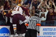 The Gophers celebrate Keith Ballard's first-period goal against Maine in the 2002 NCAA championship game at Xcel Energy Center.