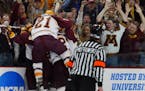 The Gophers celebrate Keith Ballard's first-period goal against Maine in the 2002 NCAA championship game at Xcel Energy Center.