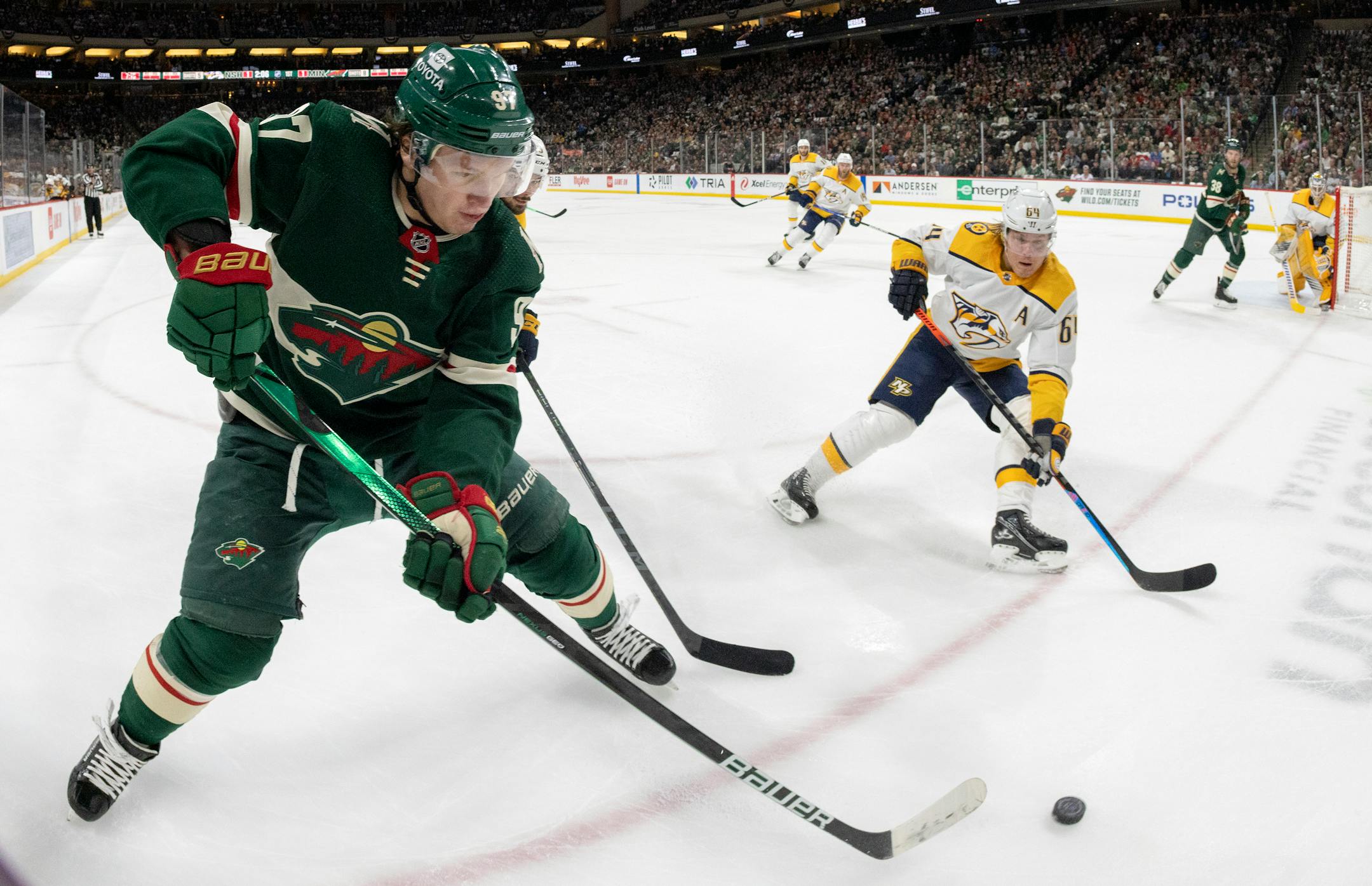 Kirill Kaprizov (97) of the Minnesota Wild chases a puck in the corner in the first period.