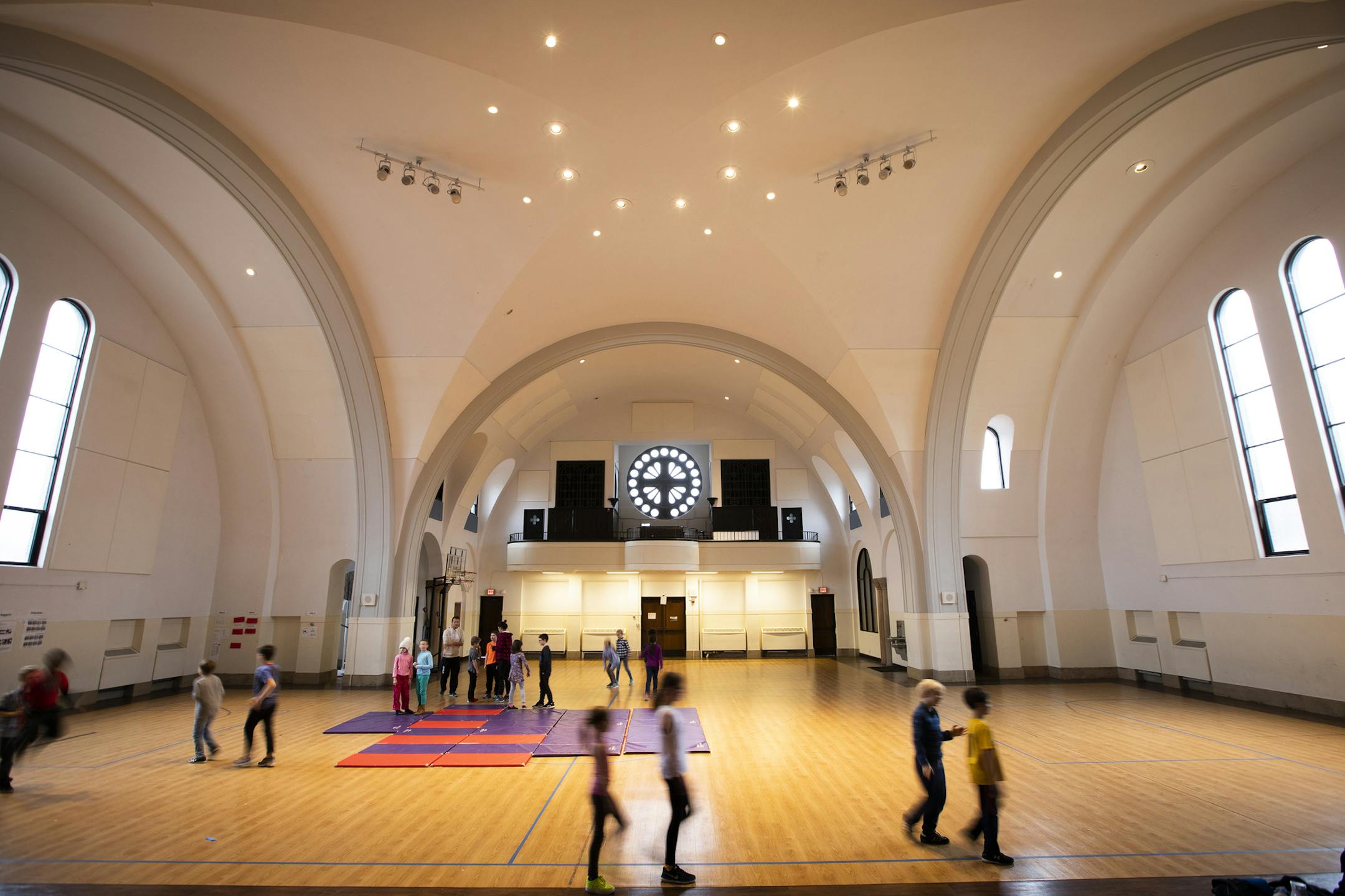 Students play during gym class. ] LEILA NAVIDI ¥ leila.navidi@startribune.com BACKGROUND INFORMATION: The Twin Cities German Immersion School in St. Paul on Monday, November 5, 2018. The school wants to tear down the building, the former St. Andrew's Catholic Church, to erect a modern school building to accomodate their growing student population, but some neighbors want to designate the church as an historic site.