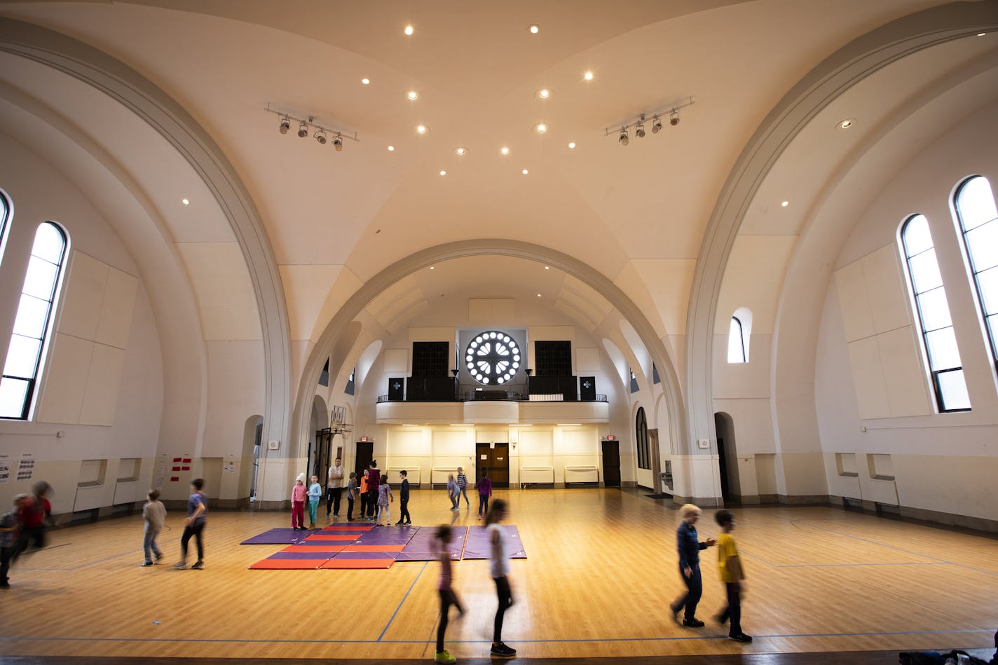 Students play during gym class. ] LEILA NAVIDI &#xa5; leila.navidi@startribune.com BACKGROUND INFORMATION: The Twin Cities German Immersion School in St. Paul on Monday, November 5, 2018. The school wants to tear down the building, the former St. Andrew's Catholic Church, to erect a modern school building to accomodate their growing student population, but some neighbors want to designate the church as an historic site.