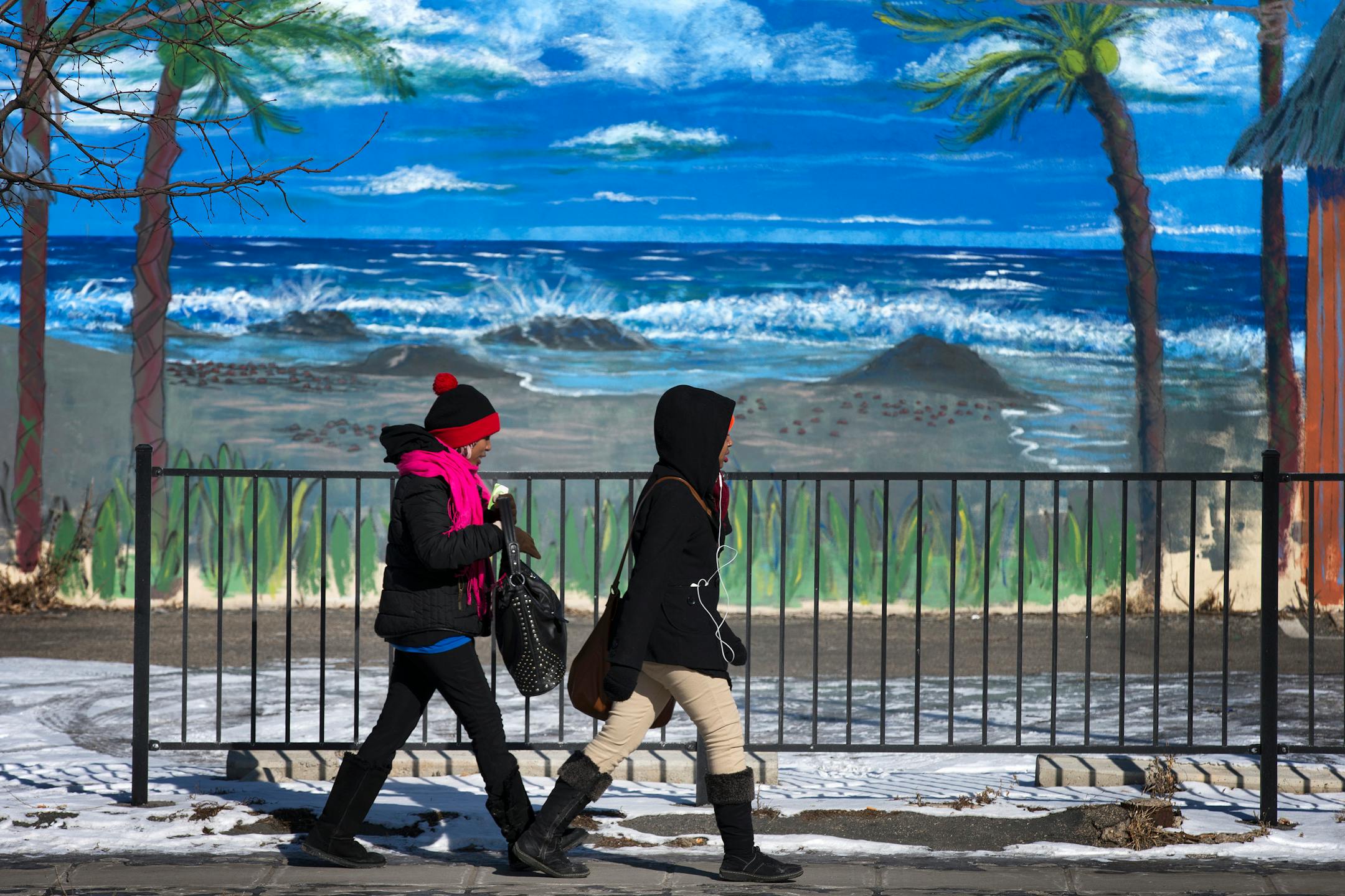 Pedestrians walks by a mural as temperatures hovered around 0 degrees in Minneapolis on Thursday, Feb. 19, 2015. The National Weather Service issued a wind chill advisory for parts of Minnesota. (AP Photo/Star Tribune, Leila Navidi) MANDATORY CREDIT; ST. PAUL PIONEER PRESS OUT; MAGS OUT; TWIN CITIES LOCAL TELEVISION OUT