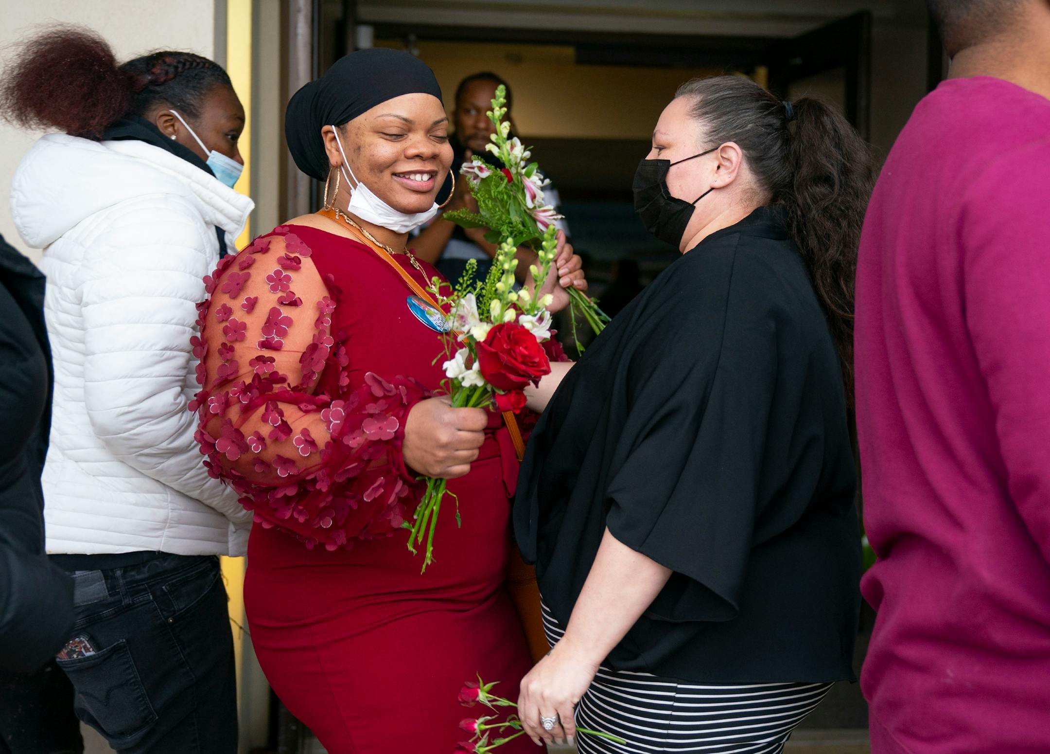 Jasmine Hollins, Jahmari Rice's aunt, chats with Katie Bryant, Daunte Wright's mother, after Jahmari's funeral.