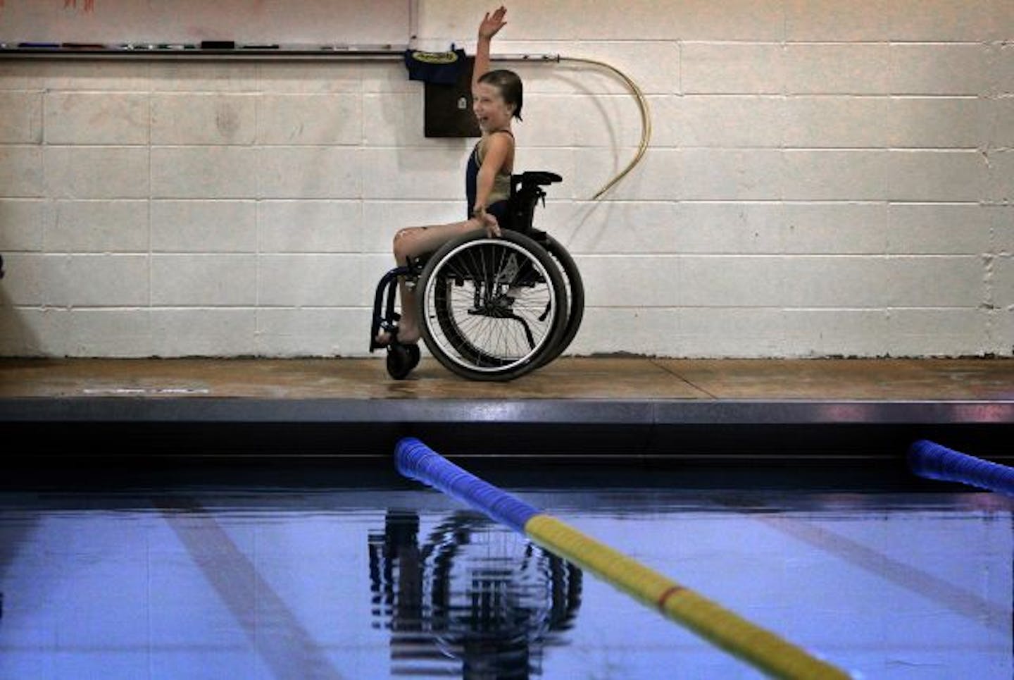 Abby Bauleke cheerfully shouted to friends across the pool at the conclusion of a swimming session.