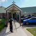 A police forensic officer works at a crime scene at the Christ the Good Shepherd church in suburban Wakely in western Sydney, Australia, Tuesday, Apri