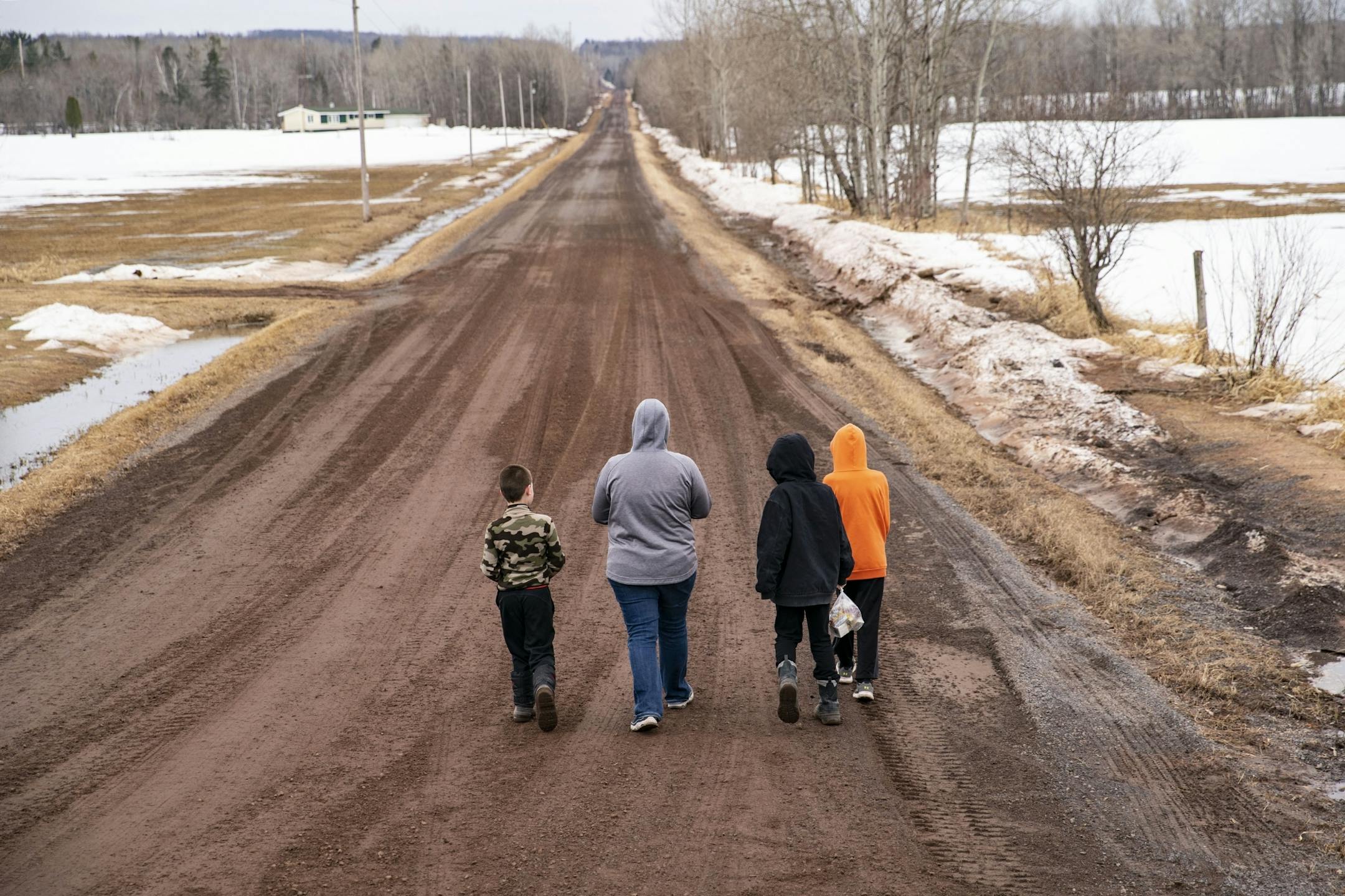 The Madsen family walked down a long country road to receive their free lunches on Wednesday afternoon. "It's like their gym class", their mother said.