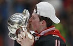 Canada's Alexis Lafreniere kisses the trophy after winning the U20 Ice Hockey Worlds gold medal match between Canada and Russia in Ostrava, Czech Repu