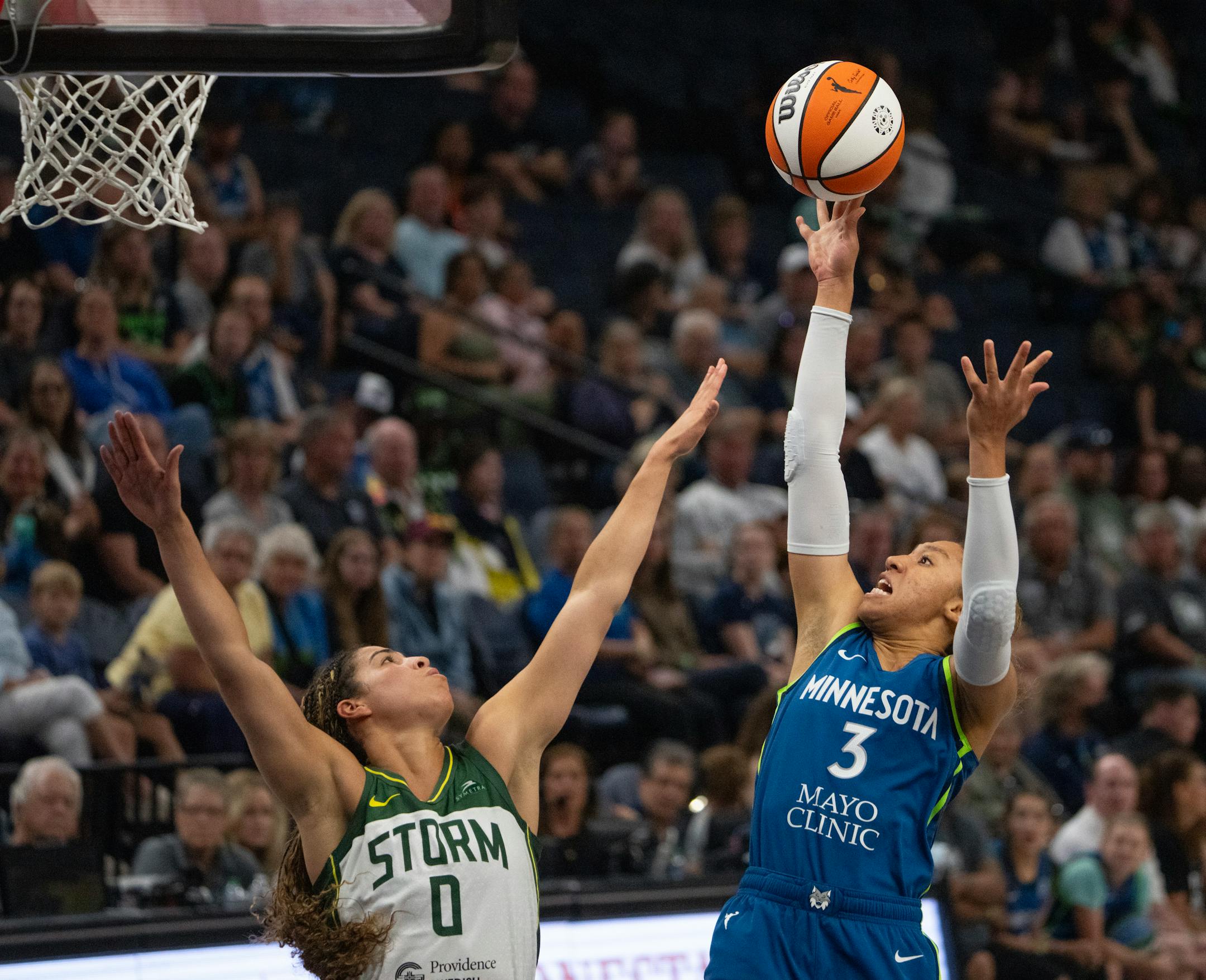Minnesota Lynx forward Aerial Powers shot over Seattle Storm guard Kia Nurse in the fourth quarter.
