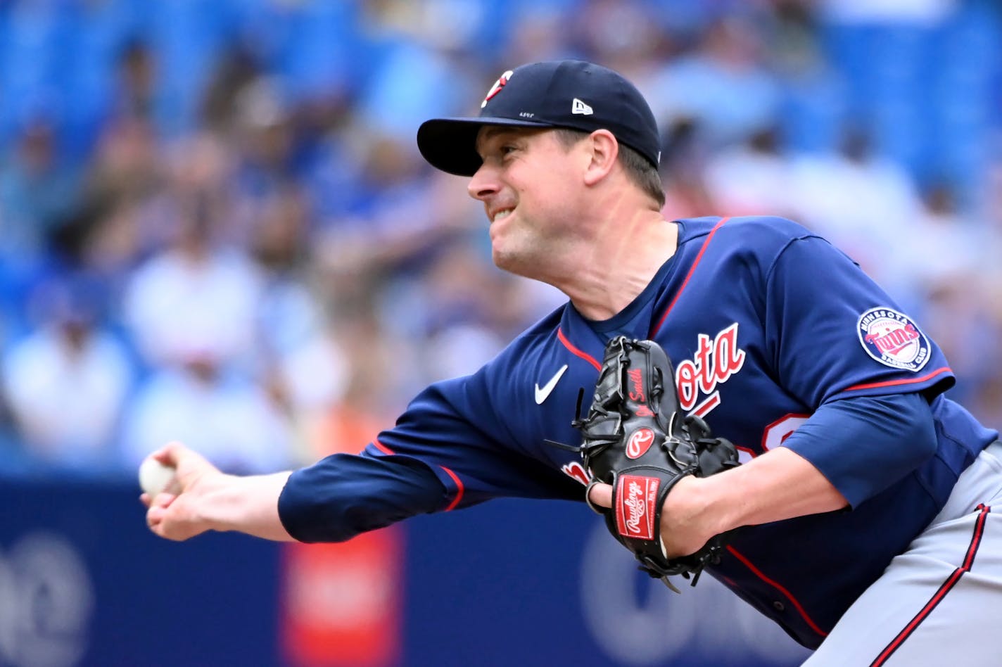 Minnesota Twins relief pitcher Joe Smith throws to a Toronto Blue Jays batter in the seventh inning of a baseball game in Toronto, Sunday, June 5, 2022. (Jon Blacker/The Canadian Press via AP)