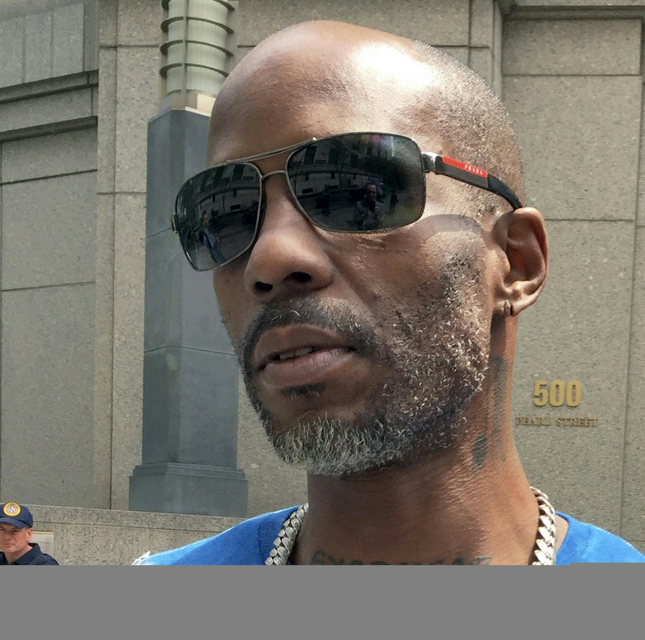 FILE - In this Aug. 11, 2017, file photo, rapper DMX, whose given name is Earl Simmons, leaves federal court in New York. In a court document made public Monday, March 26, 2018, an attorney for DMX said he plans to use music to convince a judge that his client deserves leniency for his tax evasion conviction. (AP Photo/Larry Neumeister, File)