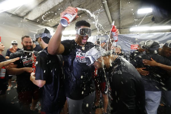 Minnesota Twins celebrate after the Twins clinched the AL Central on Wednesday, Sept. 25, 2019, in Detroit. The Twins defeated the Detroit Tigers 5-1 