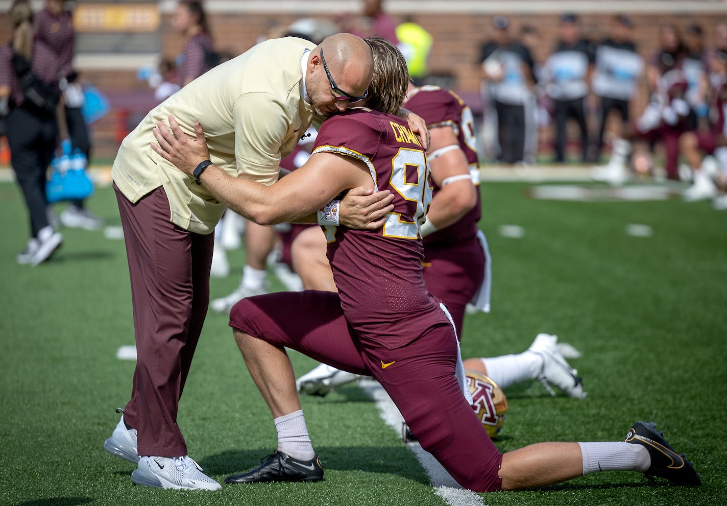 Gopher Head Coach P. J. Fleck give Minnesota's punter Mark Crawford (96) a hug before the Gophers take on Colorado at Huntington Bank Stadium in Minneapolis, Minn., on Saturday, Sept. 17, 2022. ] Elizabeth Flores • liz.flores@startribune.com