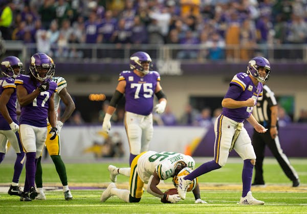 Minnesota Vikings quarterback Kirk Cousins (8) reacted after Green Bay Packers free safety Darnell Savage (26) intercepted his second quarter pass Sun