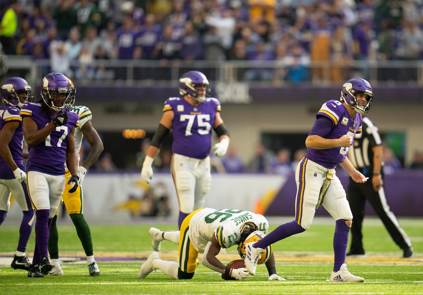 Minnesota Vikings quarterback Kirk Cousins (8) reacted after Green Bay Packers free safety Darnell Savage (26) intercepted his second quarter pass Sunday, Nov. 21, 2021 in Minneapolis, Minn. The play was negated by a roughing the passer penalty on Green Bay. The Minnesota Vikings faced the Green Bay Packers in an NFL football game Sunday, Nov. 21, 2021 afternoon at U.S. Bank Stadium in Minneapolis. ] JEFF WHEELER • Jeff.Wheeler@startribune.com