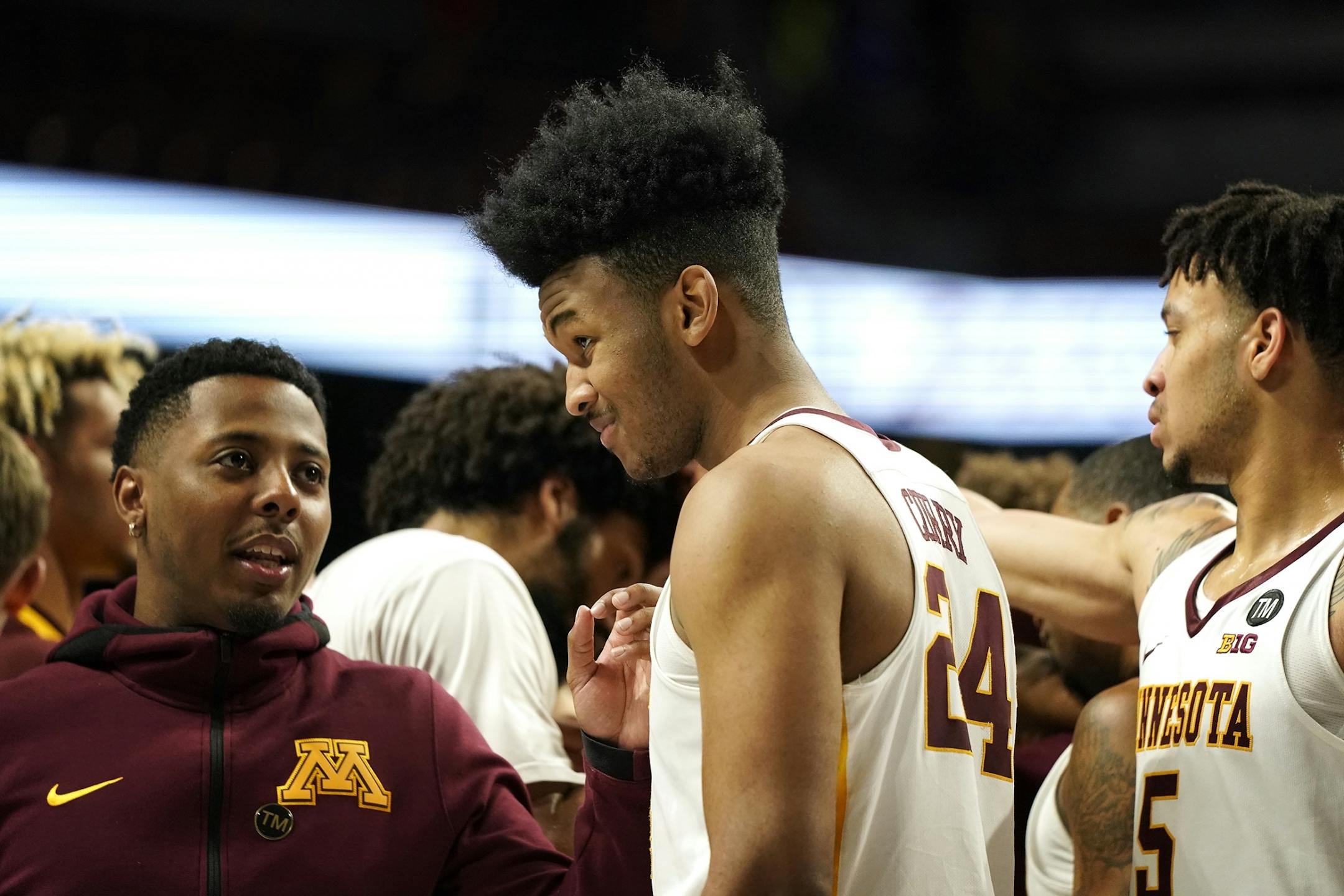 Minnesota forward Eric Curry (24) joins the team for a huddle after their win over Mount St. Mary's.