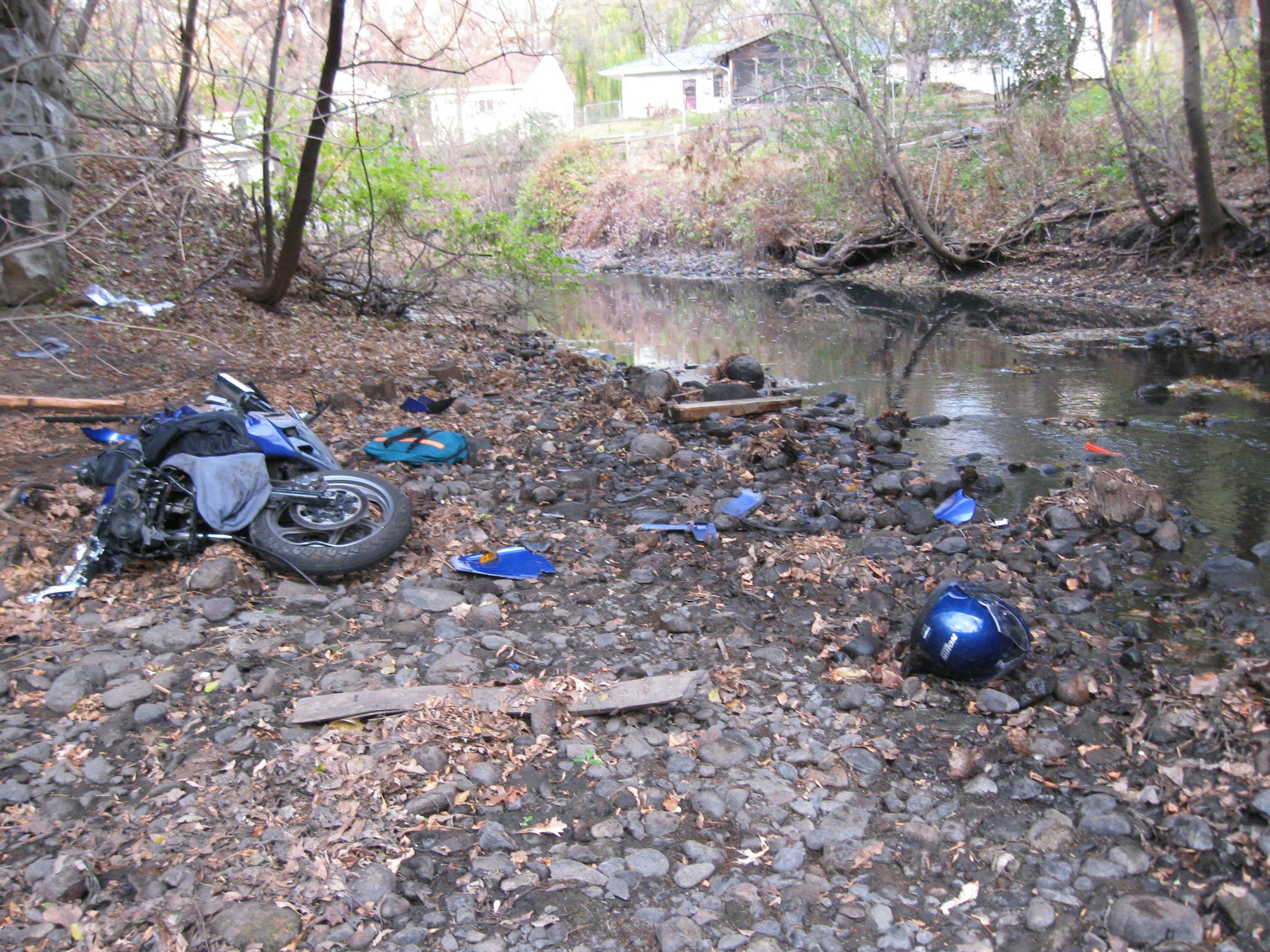 Two motorcycle riders were injured when their motorcycle crashed down an embankment during an illegal ride on a bike trail.