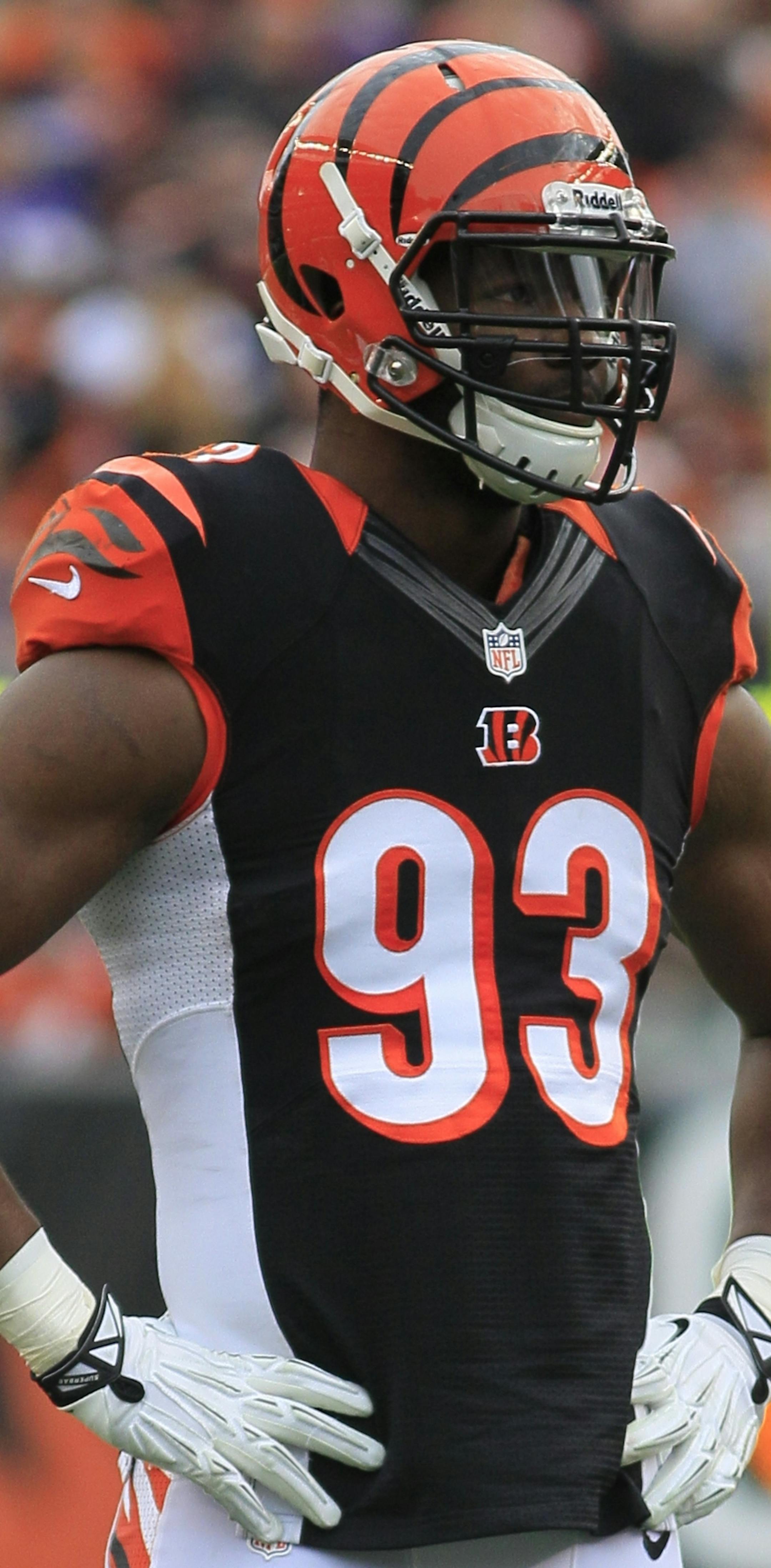 Cincinnati Bengals defensive end Michael Johnson stands on the field during an NFL football game against the Minnesota Vikings, Sunday, Dec. 22, 2013, in Cincinnati. (AP Photo/Tom Uhlman) ORG XMIT: PBS101