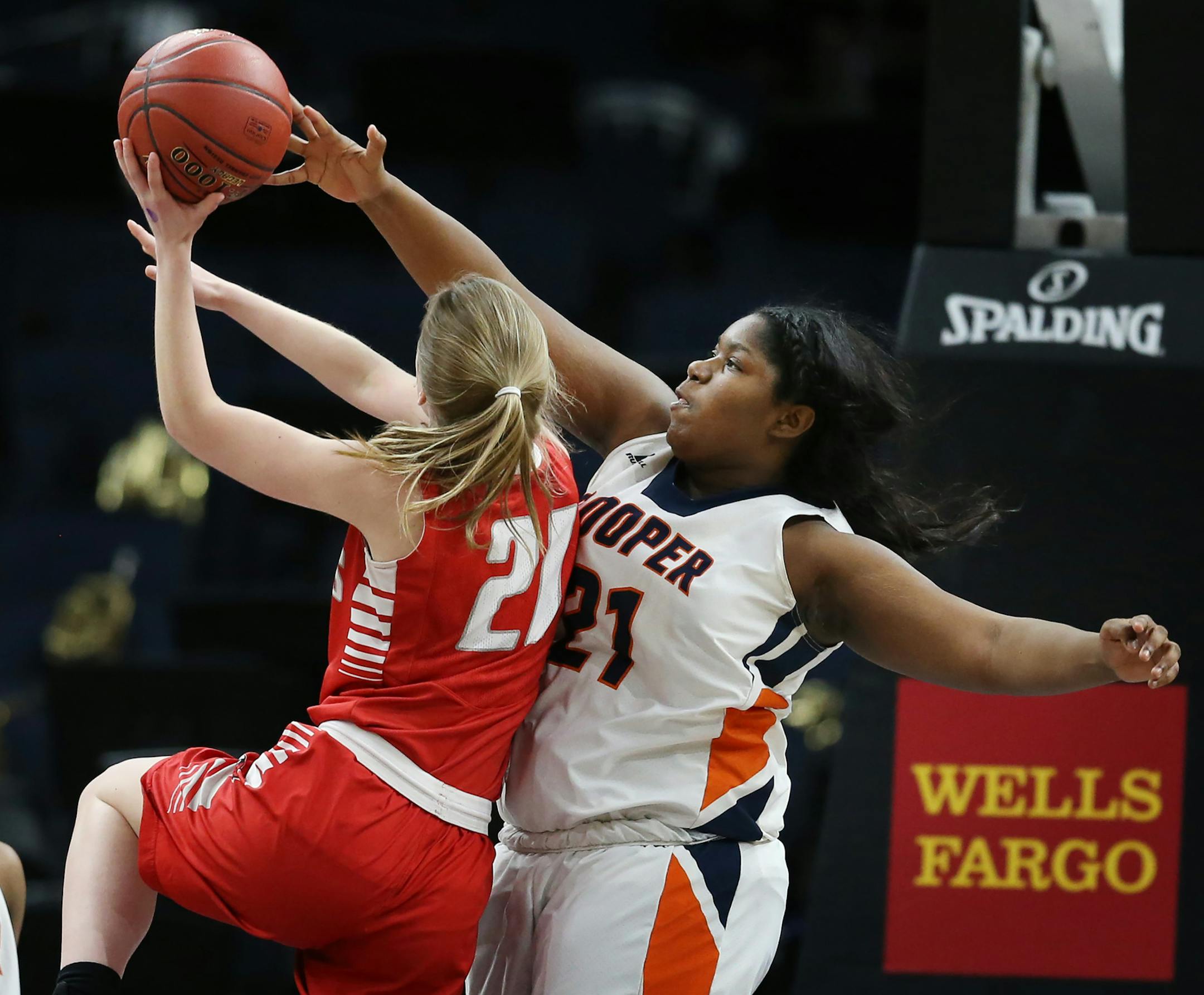 Hawks Kierra Wheeler blocked Sadie Raitz shot during girls class 3A semifinals action at Target Center Thursday March 15, 2018 in Minneapolis, MN.] The Robbinsdale Cooper Hawks played Willmar Cardinals. JERRY HOLT ï jerry.holt@startribune.com