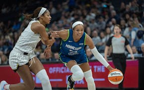 Lynx forward Napheesa Collier drives past Chicago Sky forward Angel Reese during the third quarter Saturday at Target Center.