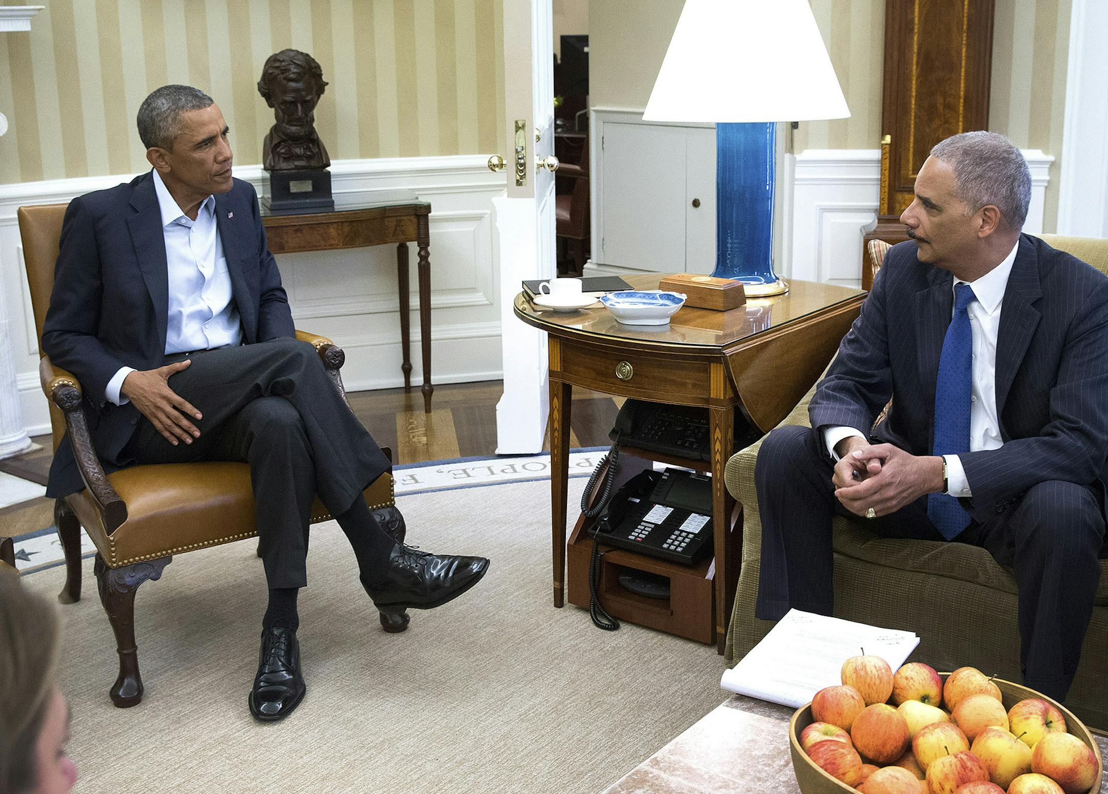 President Barack Obama meets with Attorney General Eric Holder to receive an update on the situation in Ferguson, Missouri, in the Oval Office of the White House in Washington, Aug. 18, 2014. The governor deployed the Missouri National Guard to the Ferguson on Monday, ratcheting up efforts to quell unrest that followed the killing of an unarmed black teenager by a white police officer. (Doug Mills/The New York Times) ORG XMIT: MIN2014081814154850