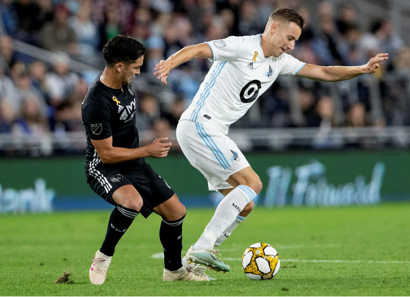 Jan Gregus (8) of Minnesota United FC controlled the ball against a Sporting Kansas City defender in a Sept. 25, 2019 match at Allianz Field in St. Paul. The Loons will resume their 2020 season on July 12 against Sporting KC in Orlando.