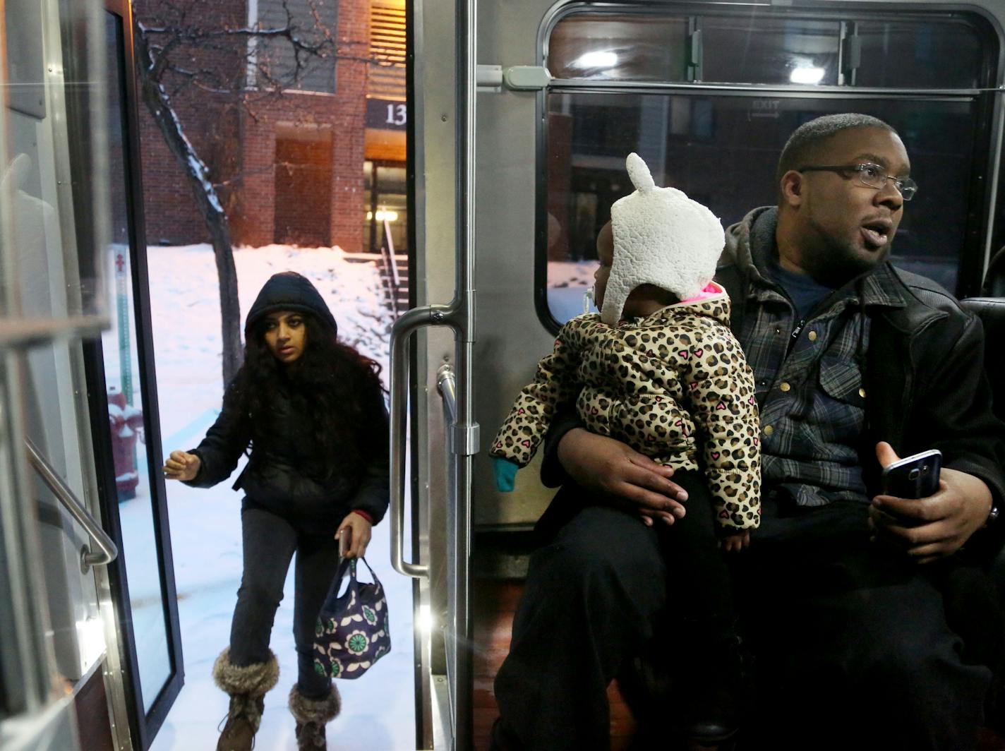 Josh Phillips and his daughter Laree, 1, were taking the Prime service from SouthWest Transit bus to Laree's daycare. Rider Rama Vibushnan got on board in Eden Prairie.