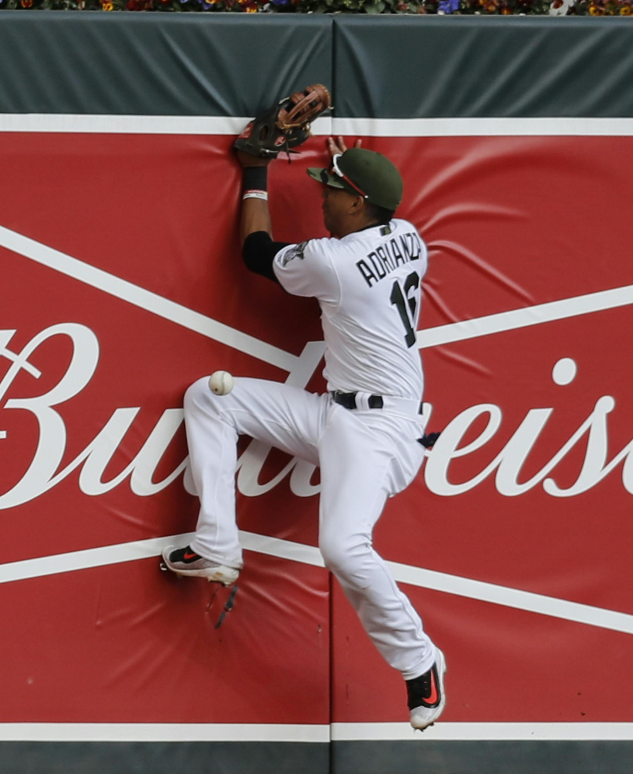 Minnesota's Ehire Andrianza missed the catch as he jumped into the wall to catch a single by Houston's Marwin Gonzalez (9) that scored two runs in the eighth inning at Target Field in Minneapolis, Minn. on Monday, May 29, 2017. ] RENEE JONES SCHNEIDER • renee.jones@startribune.com Twins verses Astros at Target Field on Monday, May 29, 2017.