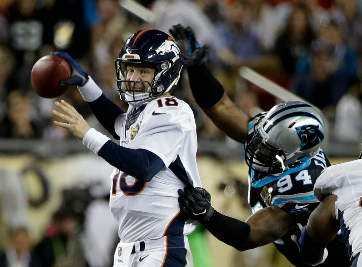 Broncos quarterback Peyton Manning lost the football when hit by the Panthers' Kony Ealy during the second half of the Super Bowl 50 on Sunday.