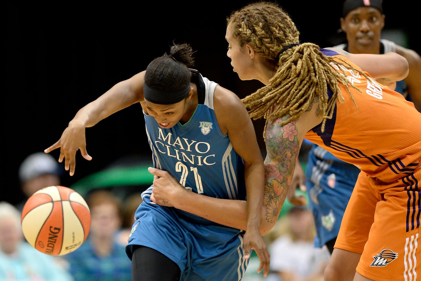 Phoenix Mercury center Brittney Griner (42) fouled Minnesota Lynx guard Renee Montgomery (21) in the second quarter.