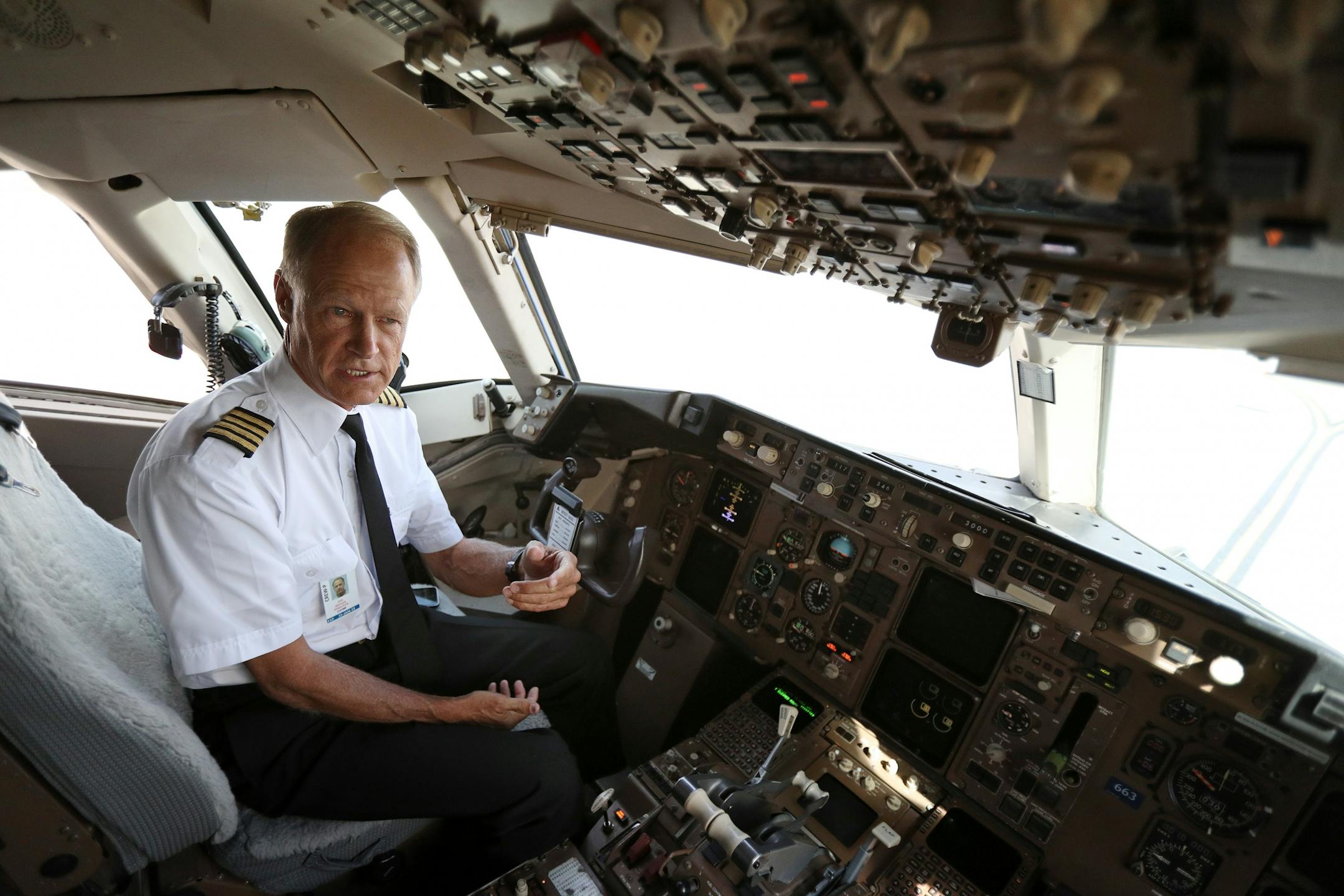 Delta pilot Jon Michael Pendleton explained the Federal Aviation Administration's Next Generation Air Transportation System for members of the media from the cockpit of an aircraft Tuesday.
