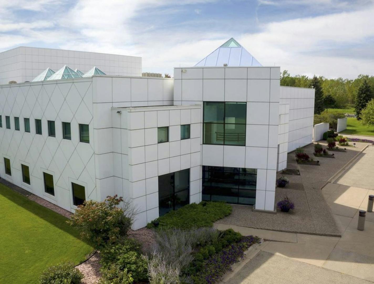 This undated photo provided by Paisley Park/NPG Records shows the exterior of Prince's Paisley Park in Chanhassen, Minn. Prince's handwritten notes are still sitting out inside the control room of Studio A where he recorded some of his greatest hits. It's filled with keyboards and guitars. Those are some of the highlights visitors will see when Prince's home and work space, Paisley Park, opens for its first public tours Thursday, Oct. 6, 2016. (Paisley Park/NPG Records via AP) ORG XMIT: MIN20161