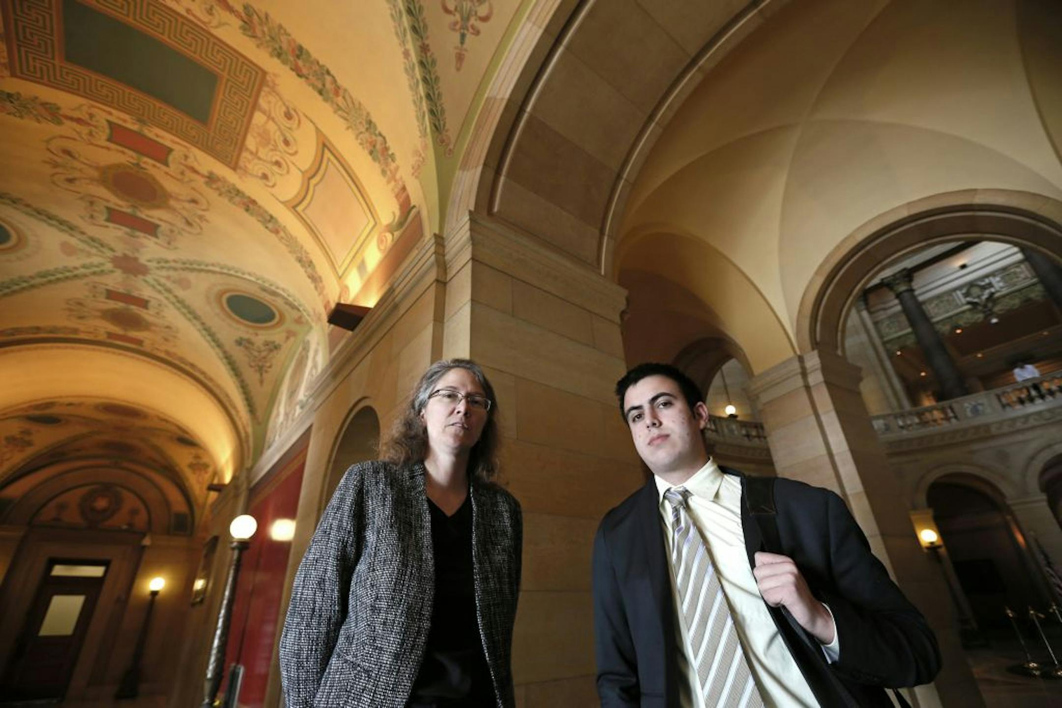 Heather Martens, left, director of Protect Minnesota, and Sami Rahamim, 17, the son of Reuven Rahamim, who was one of six men who died after being shot by Andrew Engeldinger on Sept. 27, 2012, were at the capitol Thursday.