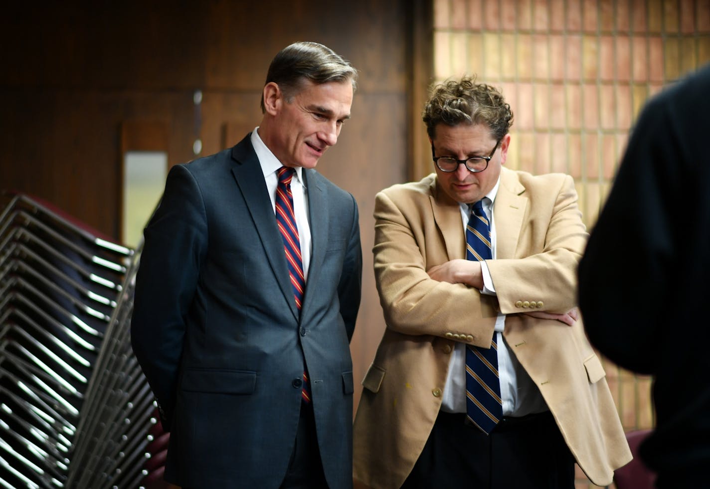 Greg Brooker, Acting U.S. Attorney, MN, left, talked with Steve Hunegs, JCRC Executive Director before the meeting.