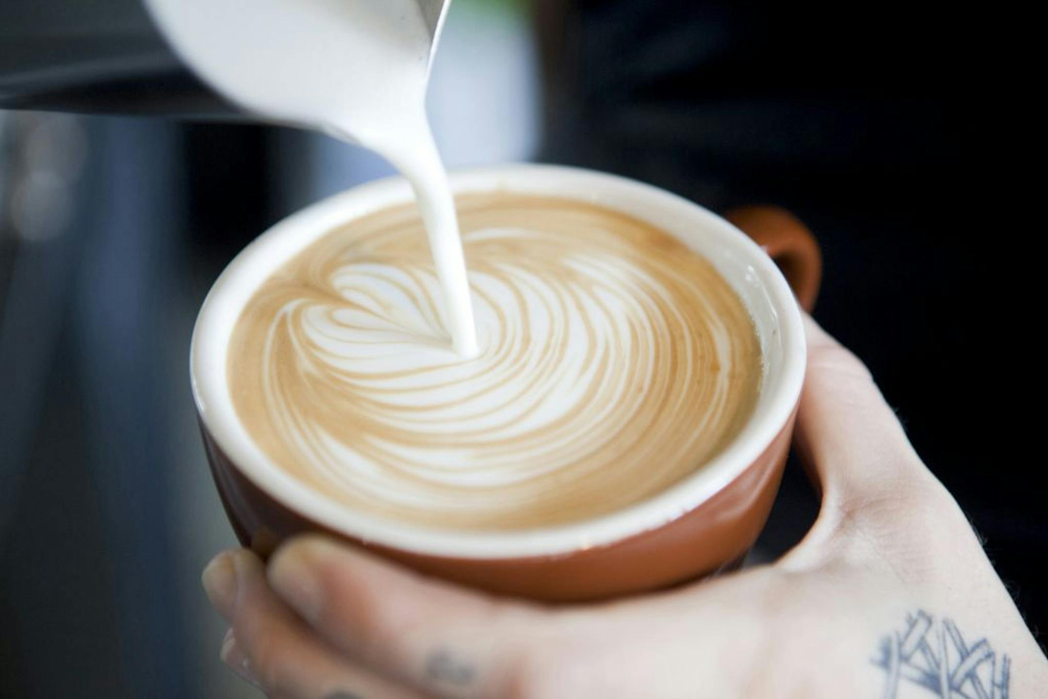 Kaki Metcalfe, a barista at Not Just Coffee, offers pour-overs at the 7th Street Public Market in Charlotte, N.C., Aug. 17, 2012. Dedicated eaters heading to Charlotte for the Democratic National Convention will find a city newly interested in how it eats.