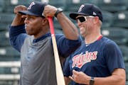 Torii Hunter and Michael Cuddyer are special coaches for the Twins; they enjoyed a laugh during spring training in 2020.