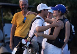Caleb VanArragon hugs his sister, Kathryn, after he finished second in the Minnesota State Open.