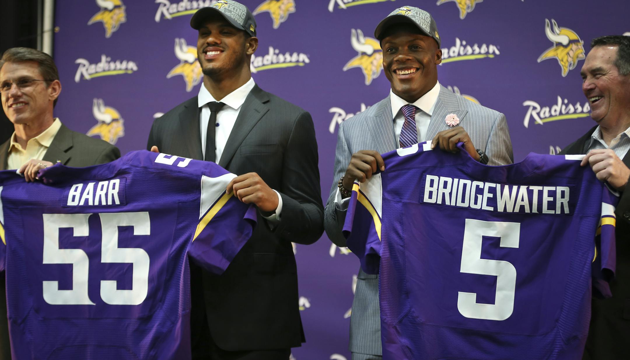 Vikings GM Rick Spielman (left) and head coach Mike Zimmer (right) stood with first round draft choices Anthony Barr and Teddy Bridgewater during a press conference on Friday, May 9, 2014 at Winter Park in Eden Prairie, Minn. ] RENEE JONES SCHNEIDER • reneejones@startribune.com